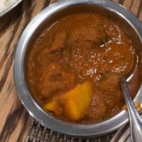 Lamb Vindaloo · Cooked with potatoes and home made spicy sauce.
