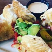 Southwest Chicken Egg Rolls · Two handmade egg rolls stuffed with chicken, bacon, avocado, tomato, muenster, and cheddar c...