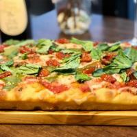 Margherita Pizza · Imported fresh mozzarella, marinara sauce, Sicilian sun dried tomatoes, drizzled basil pesto...