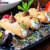 Canolicchi · Small cannolis filled with sweetened ricotta cream, garnished with Sicilian-Bronte pistachio