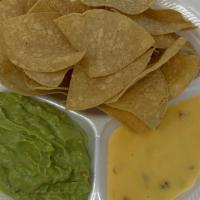 Chips/ Queso /Guacamole Grande · Corn tortilla chips with nacho cheese 6 oz and guacamole  6 oz