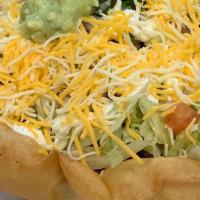 Taco Salad  · A crispy flour tortilla bowl with your choice of meat over a bed of beans & rice, topped wit...