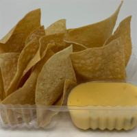 Chips /Queso 4Oz · Corn tortilla chips with nacho cheese.