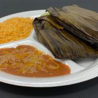 Tamale Plate · Two tamales with your choice of pork or chicken, wrapped in banana leaf. Served with rice an...