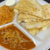 Quesadilla · Your choice of meat and cheese; sour cream on the side , served with rice and beans.