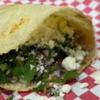 Gordita · A Thick corn tortilla stuffed with your choice of meat, beans,  onions,  cilantro and queso ...