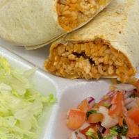 Burrito · A flour tortilla filled with your choice of meat rice and beans.  2oz of nachos cheese sauce...