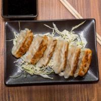 Gyoza · Tenka Ramen favorite: Pan-fried pork dumpling served with a soy vinegar dipping sauce.