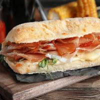 Italian Hoagie · Soft hoagie roll layered with ham, pepperoni, Canadian bacon, cheddar cheese and fresh lettu...