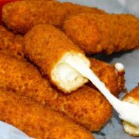 Mozzarella Sticks · Breaded mozzarella sticks deep fried to a golden brown and served with marinara sauce.