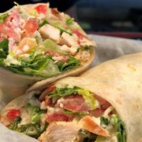 Chicken Caesar Wrap · Grilled chicken breast, romaine lettuce, tomato and Parmesan cheese tossed with classic, cre...