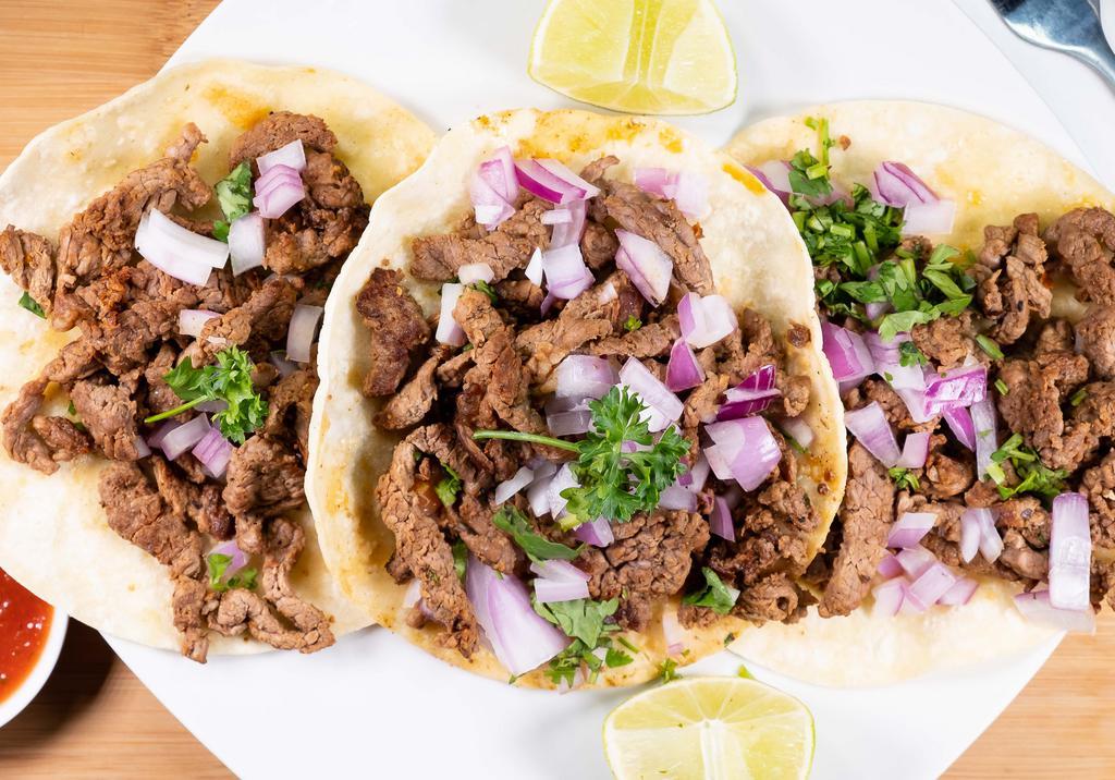 Street Tacos · Three tacos in corn tortillas, choice of grilled steak, chicken, al pastor, or carnitas. With cilatro and red onion.