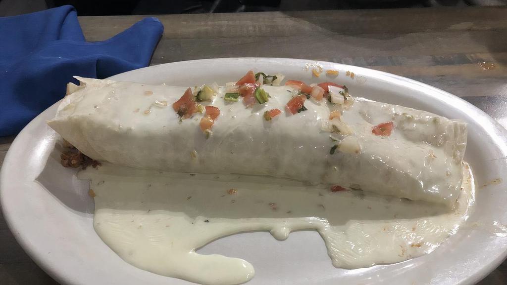 Burrito Jalisco · Burrito stuffed with grilled chicken, rice, beans, and chorizo. Covered with cheese dip then topped with pico de gallo.