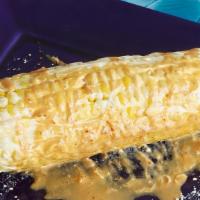 Elotes · Corn on the cob, with mayonaise, cheese, and tajin.