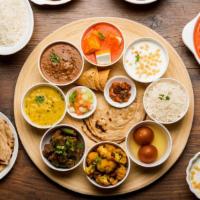 Chicken Thali · Traditional Nepali platter featuring a combination of fresh vegetable curry, chicken curry, ...