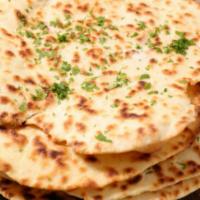 Butter Naan · Fresh pillow dough hand rolled and roasted over an open fire (tandoor) topped with a drizzle...
