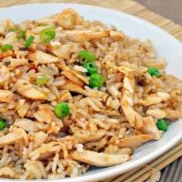 Chicken Fried Rice · Chicken, prepared steamed white rice with soy sauce, eggs, peas, carrots and green onions.