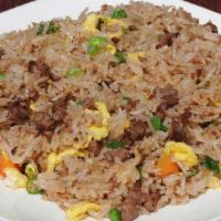 Beef Fried Rice · Beef, prepared steamed white rice with soy sauce, eggs, peas, carrots and green onions.