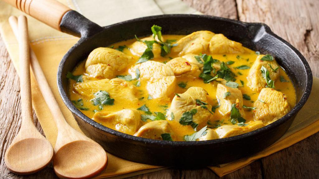 Chicken Korma · Tender pieces of boneless chicken breast cooked in a creamy sauce hinted with spices, cashew nuts and raisins.