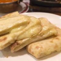 Cheese Naan · Buttery naan stuffed with paneer.