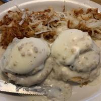 Country Eggs Benedict · Poached eggs & sausage patties served on a grilled biscuit topped with biscuit gravy. No toa...