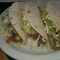 Steak Taco Dinner · Three corn or flour tortillas filled with tender steak and served with lettuce, tomatoes and...