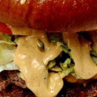 Mke Burger  · Burger, cheddar cheese, bacon jam, lettuce, tomato, and burger sauce served on a seeded brio...