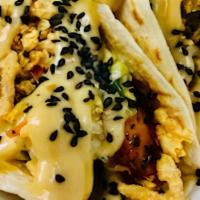 Korean Chicken Taco · . Grilled chicken, Korean BBQ, southern slaw, French's onions and sesame aioli served on flo...