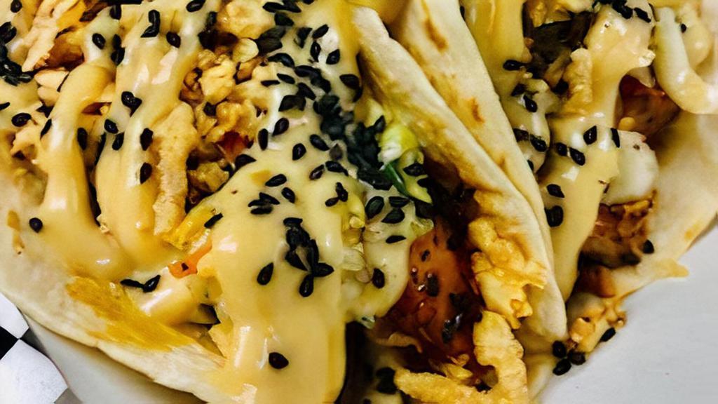 Korean Chicken Taco · . Grilled chicken, Korean BBQ, southern slaw, French's onions and sesame aioli served on flour tortilla.