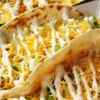 Buffalo Chicken Taco · Grilled chicken, buffalo sauce, lettuce, cheddar jack and ranch served on flour tortilla