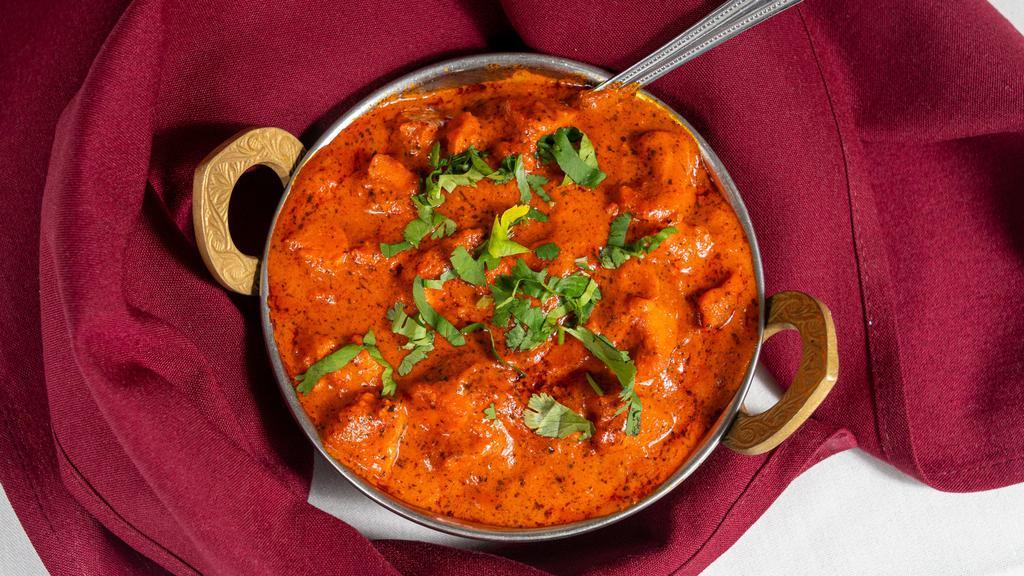 Chicken Tikka Masala · Boneless chicken breast marinated in yogurt and spices, roasted on the skewer sauteed in tomato and butter sauce.