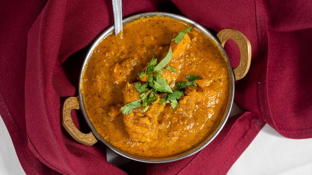 Chicken Curry · Chicken cooked with spices in thick curry sauce.
