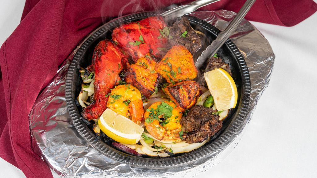 Tandoori Mixed Grill · A delicious combination of chicken, lamb seekh kabab and shrimp.