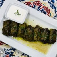 Dolma · Stuffed grape leaves with homemade ground beef and rice.