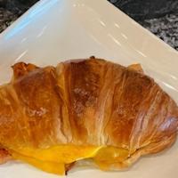 Bacon Egg & Cheddar (Turkey Bacon Available) · Choice of bagel, croissant, or wrap, egg or egg white, bacon, (Turkey Bacon Available) chedd...