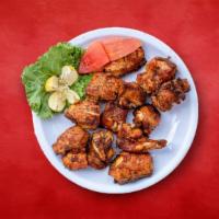 Chicken Trident Tikka · chicken marinated and barbecued in a tandoor clay oven.