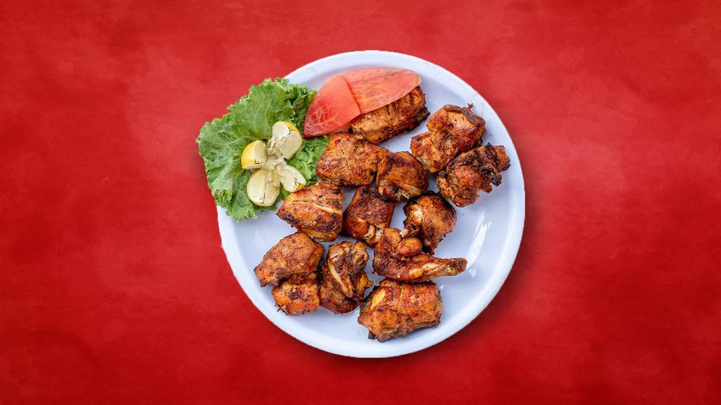 Chicken Trident Tikka · chicken marinated and barbecued in a tandoor clay oven.