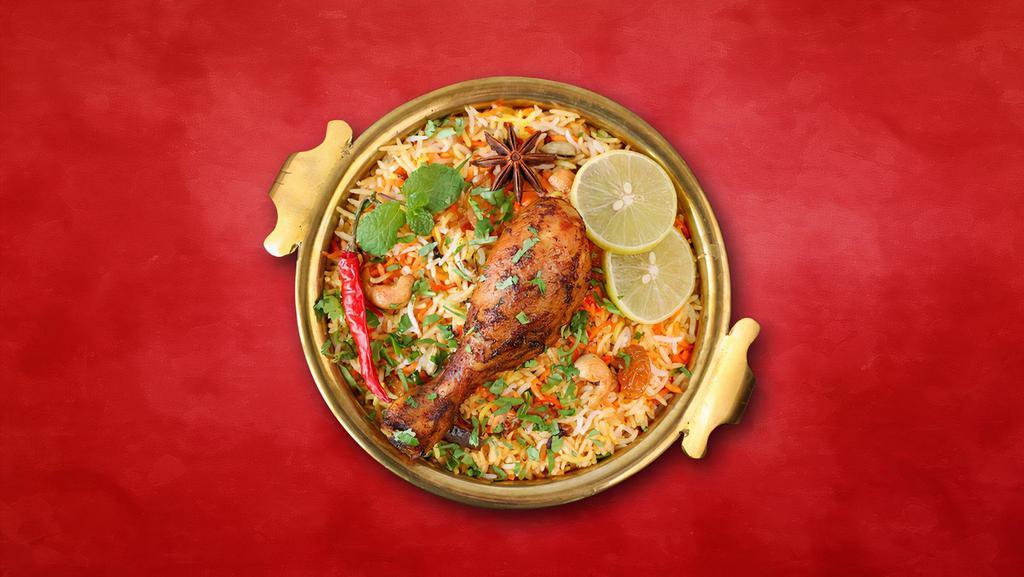 Chicken Biryani Sensation · Long grain basmati rice cooked with chicken in a blend of exotic Indian spices, and herbs. Served with raita and a light spicy curry.