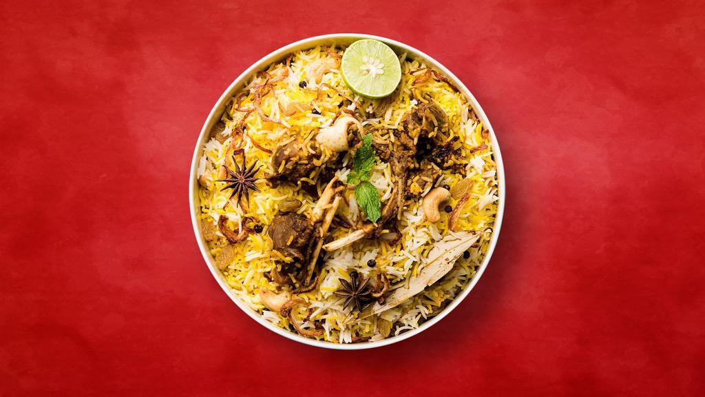 Goat Biryani Sensation · Long grain basmati rice cooked in a sealed pot with juicy pieces of lamb in a blend of exotic Indian spices and herbs. Served with raita and a light spicy curry.