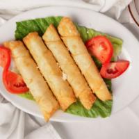 Sigara Borek · Vegetarian. Hot flaky phyllo pastries filled with feta cheese, fresh dill and parsley.