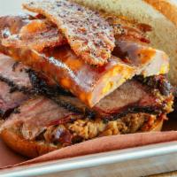 The Woodpile Sandwich · Pulled pork, brisket, sliced sausage and bacon.