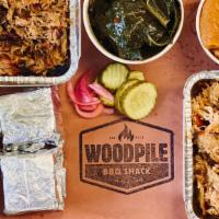 Family Meal Deal · Full pound each of pulled pork and pulled chicken, two 16oz sides, four cornbread