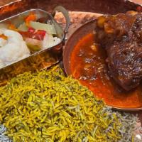 Lamb Shank Served With Baghali Polo  · a special mixture of rice, fava beans and fresh dill