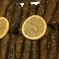 Stuffed Grape Leaves · Grape leaves, hand-rolled stuffed with rice, finely chopped vegetables (tomato, green bell p...