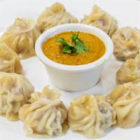 Vegetable Momo · Fresh veggies finely chopped and mixed up with fresh chopped onion and cilantro wrapped up a...