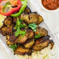 Pork Sekwa · Boneless pork meat grilled and marinaded with ginger garlic and garnished with chopped cilan...