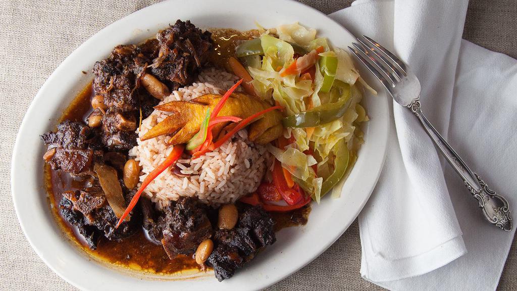 Lg Oxtail Dinner · Served with 3 sides:  rice, cabbage and plantain.  May substitute one side for an additional $1