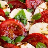 Caprese · Sliced roma tomatoes bedded with fresh mozzarella and basil, then drizzled with extra virgin...