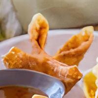 Wisconsin Crab Rangoon · Deep fried wontons filled with Wisconsin cream cheese, crab and fresh onion.