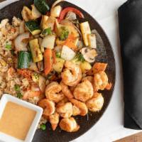 Garlic Butter Shrimp · Seasoned and dipped in garlic butter then pan seared.